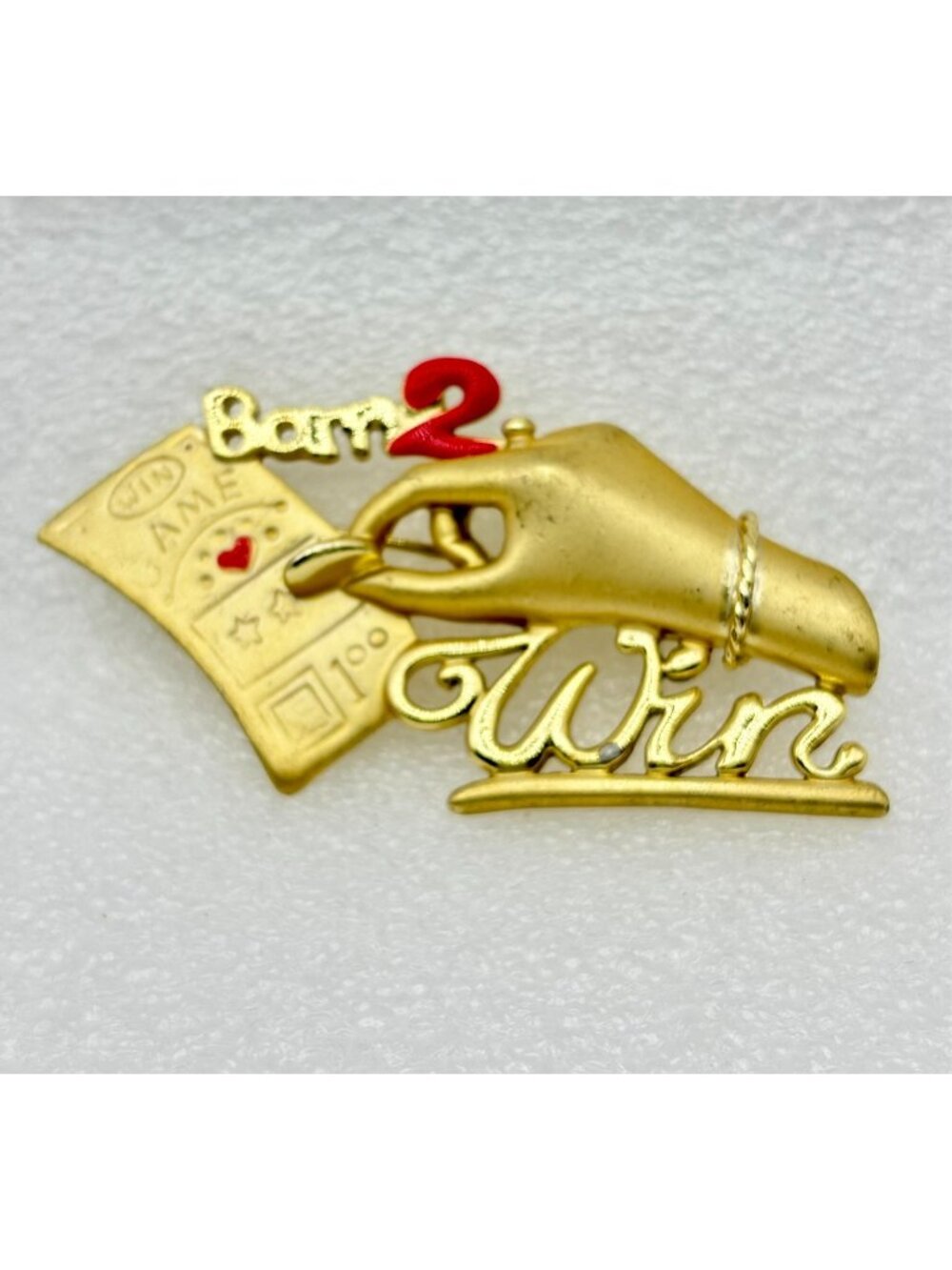 1980s Figural Born 2 Win Brushed Satin Gold Tone Betting Hand Brooch